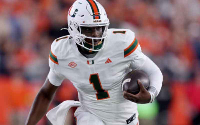 Cam Ward of the Miami Hurricanes running with the football